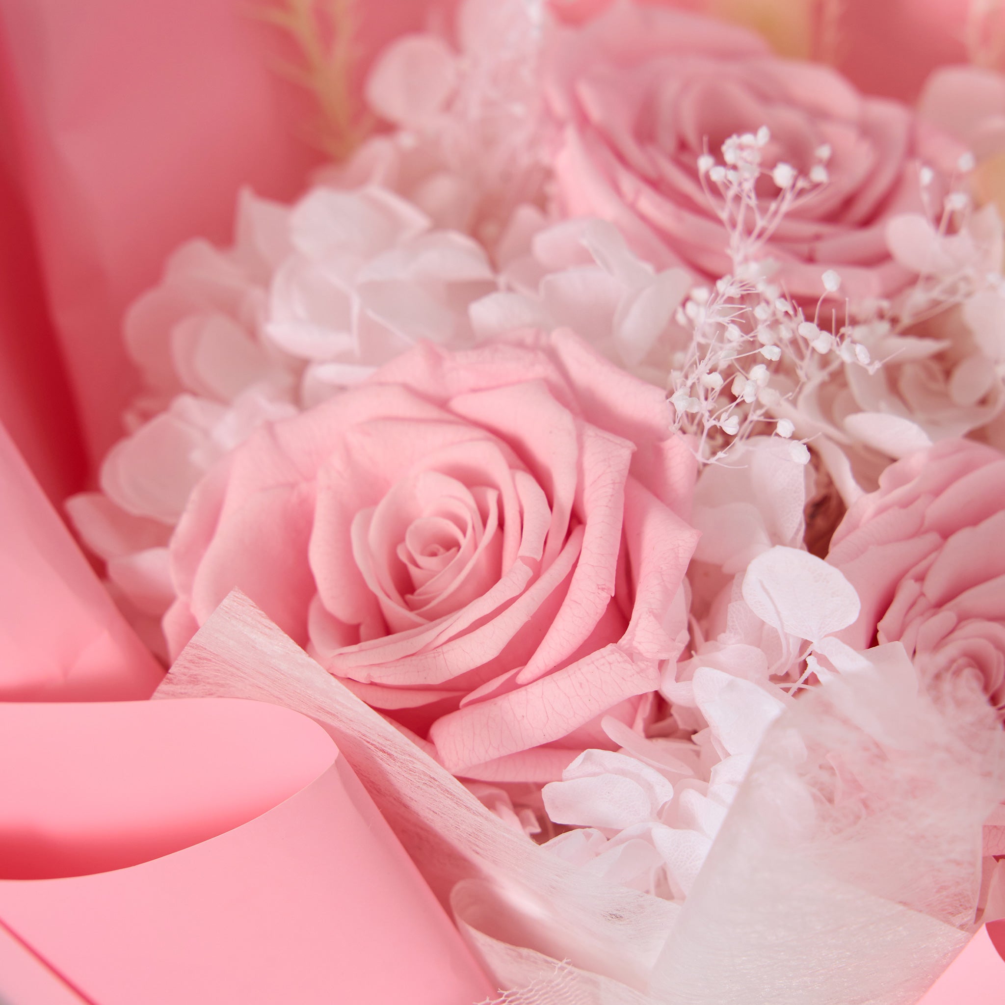 Bouquet of pink roses with white flowers